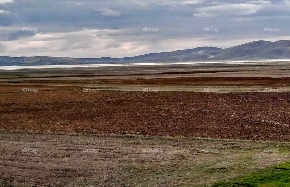 The soil of salt lake side that is specil red and less plant, but color and landscape are beautiful.