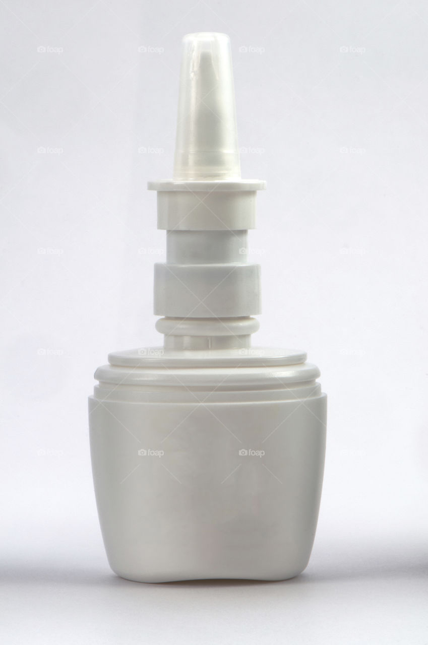dropper bottle without label on White background