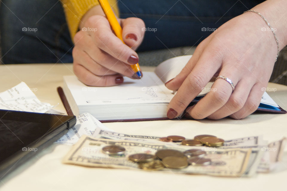 woman takes notes in notepad