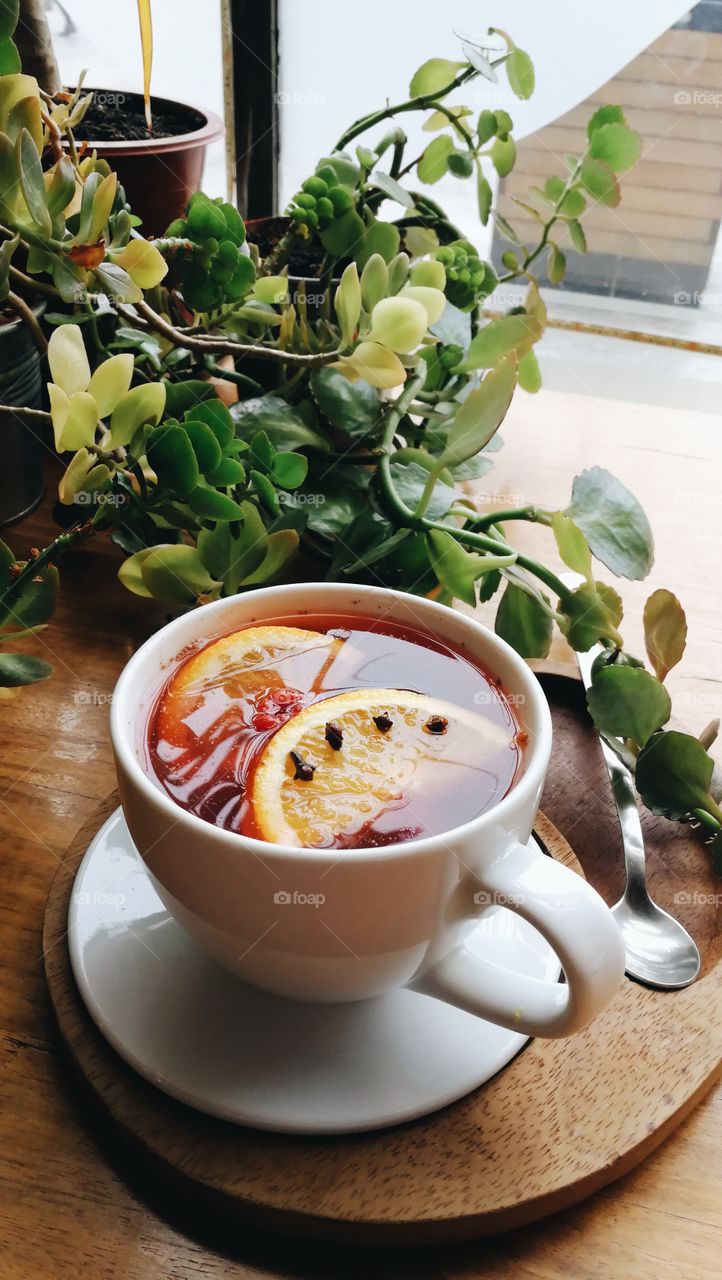 Cup of tea with fruits