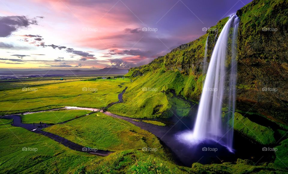 Time Lapse Photography of Waterfalls during Sunset