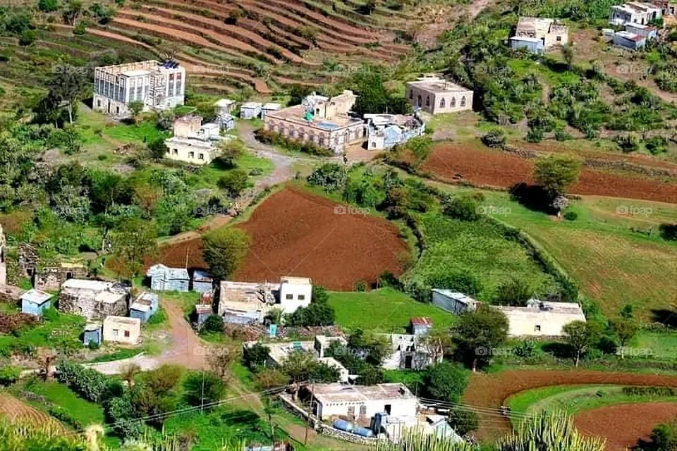 A stunning view of green mountains covered in fog in Yemen