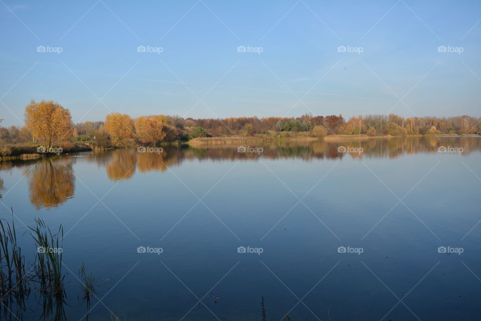 lake beautiful nature landscape autumn time blue sky background, no filters