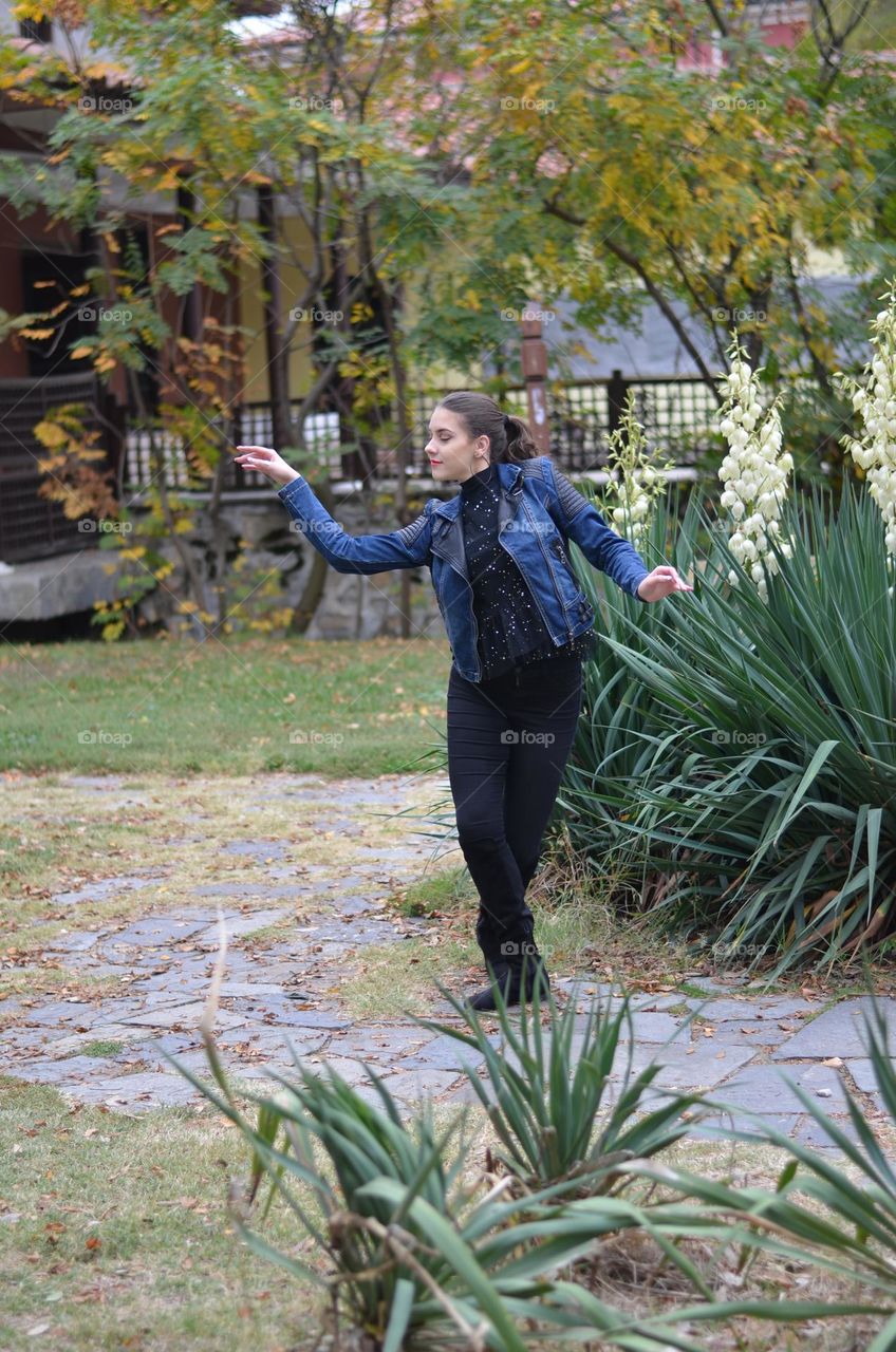 Beautiful Young Girl Dancing Outside in Nature