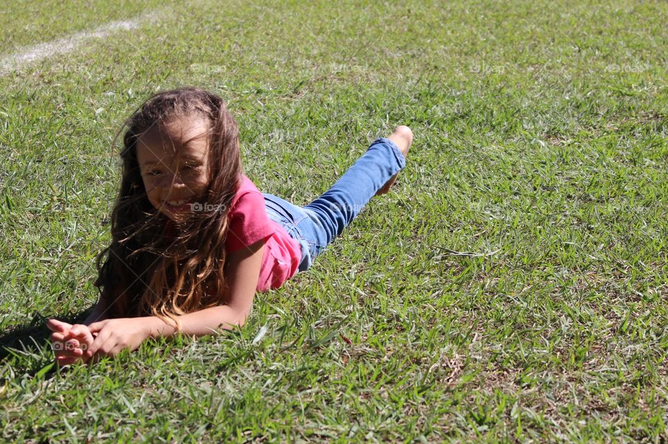 Little girl dancing outdoors