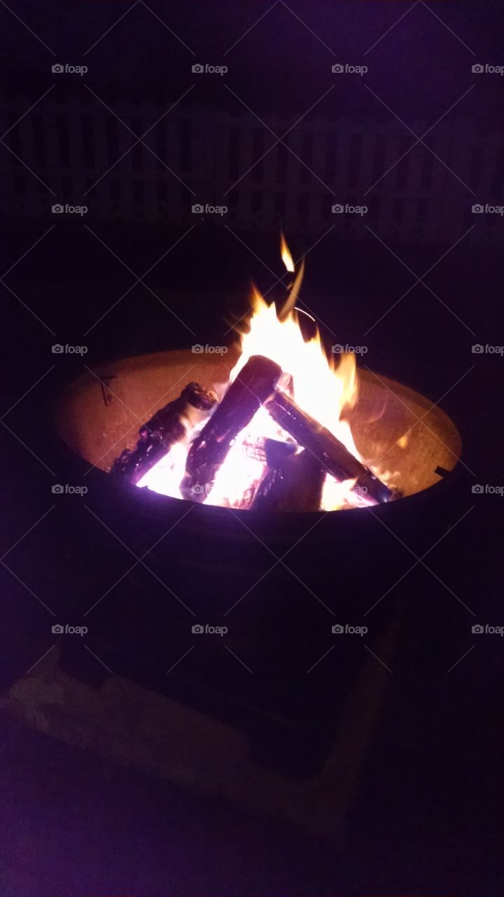 relaxing by a summer fire