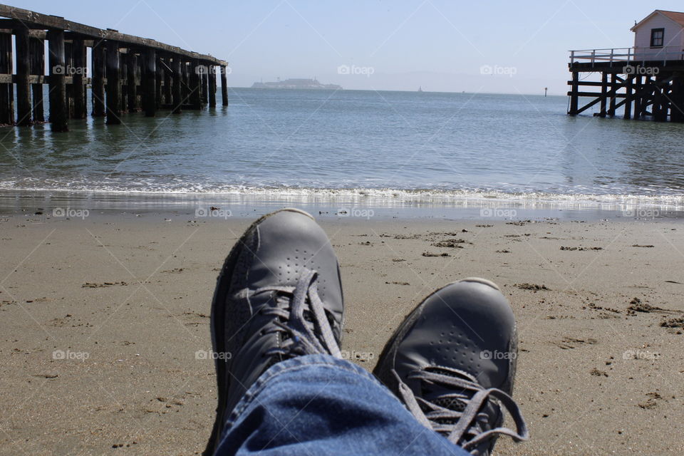 relaxing on the beach watching the waves of the ocean