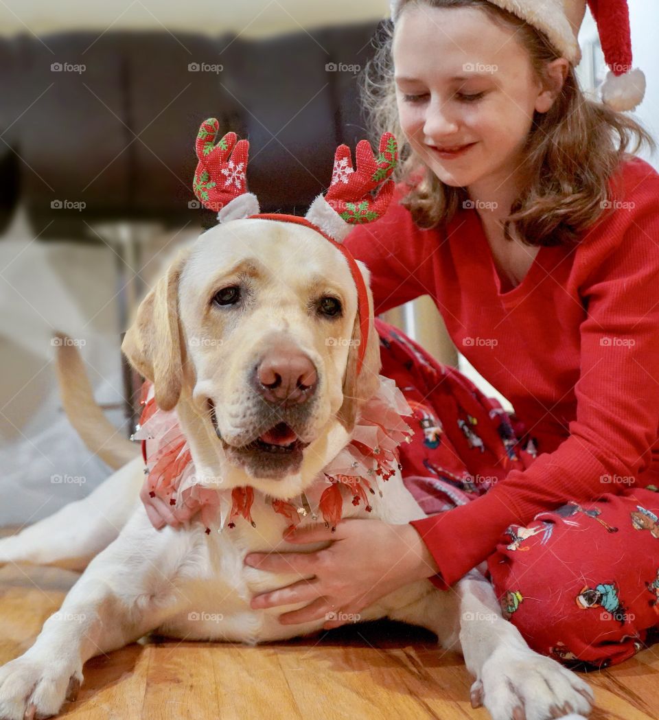 Christmas morning with girl and her yellow dog
