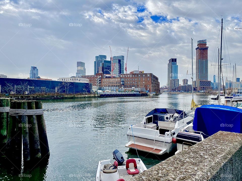 A panoramic view over the East River at Newtown Creek in Long Island City, Queens, NY on an overcast December afternoon in 2021. Hypnotic Productions