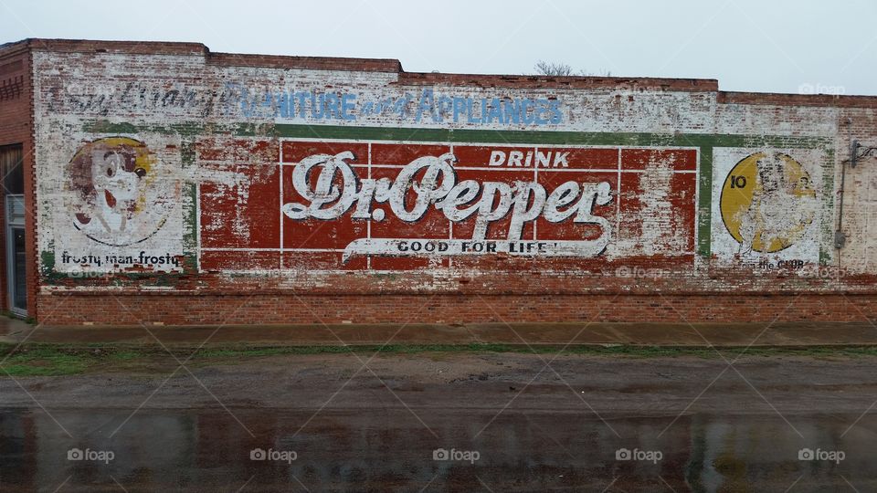 Vintage advertising full building  side!. I pass by this old building doing my job it's cool!