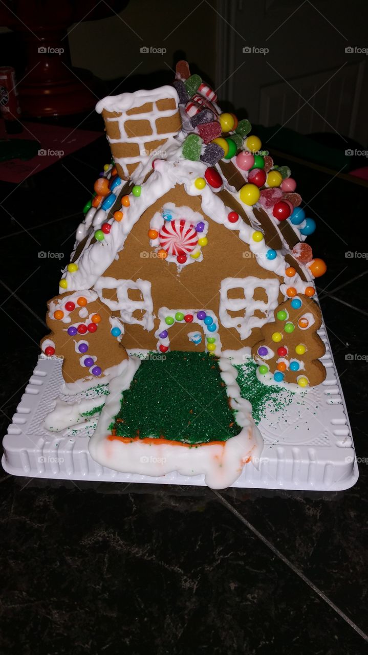 Child decorated gingerbread house