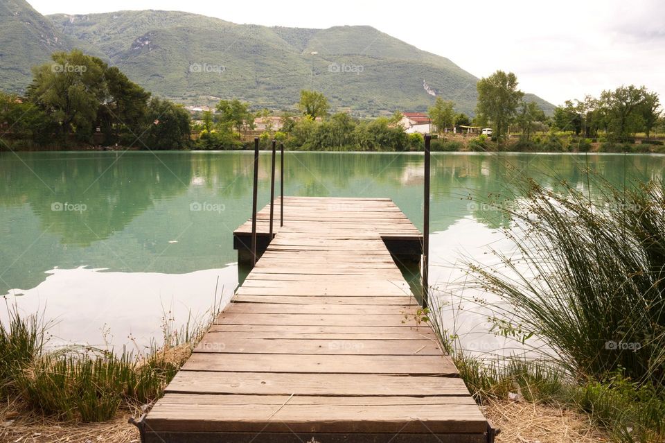 wooden platform in the middle of the lake