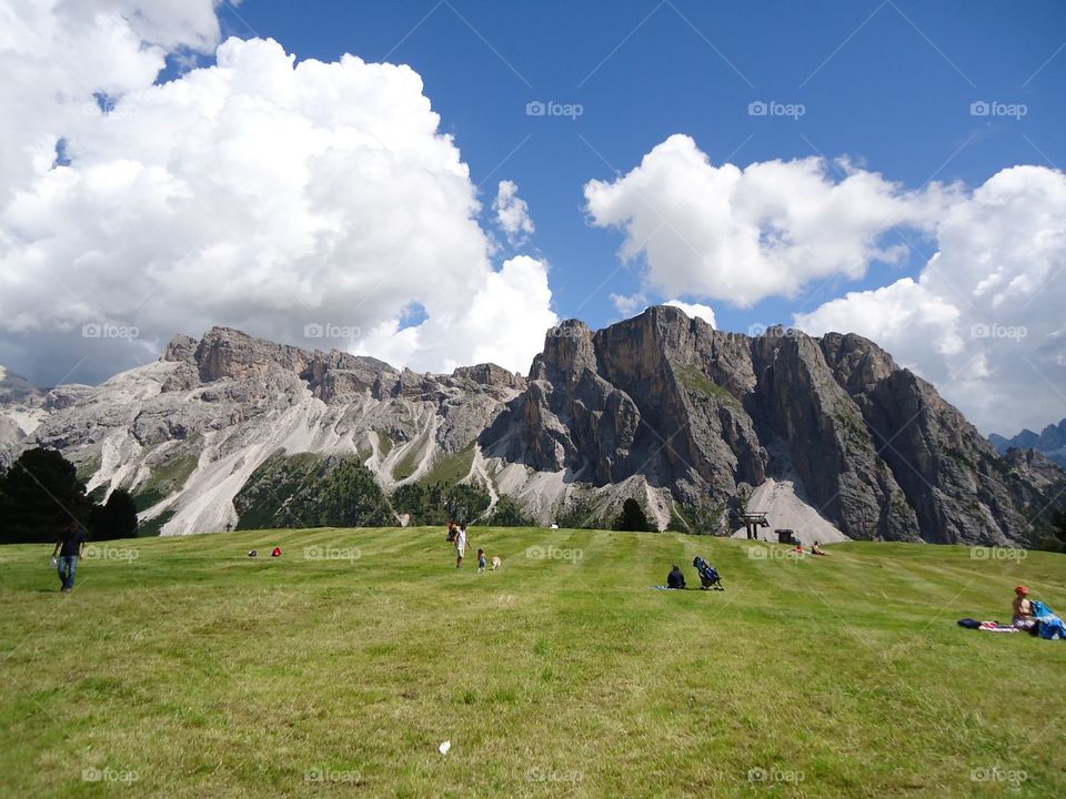 Scenics view of grassy field and mountains