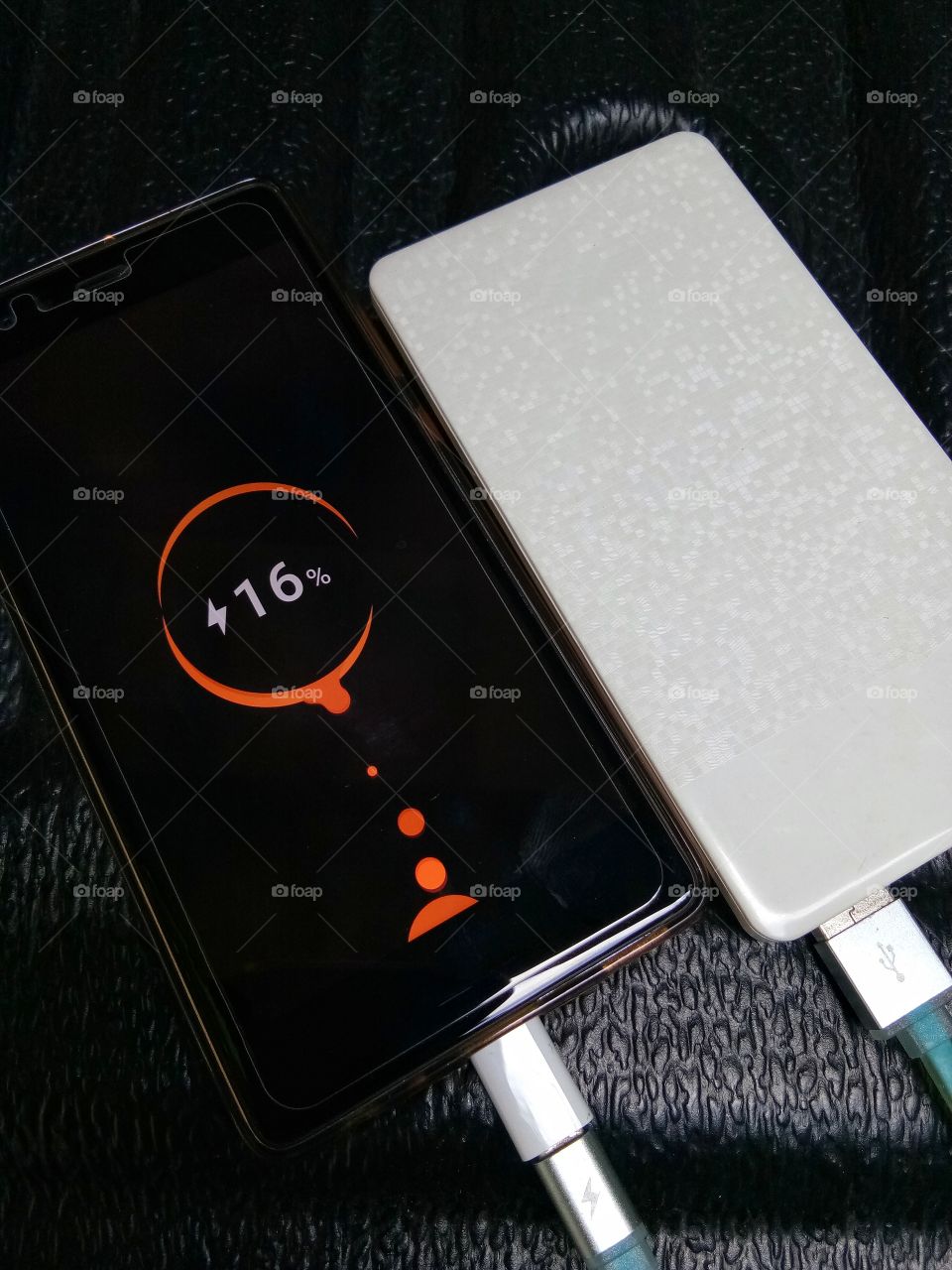 The phone battery is running low. Charge from power back.