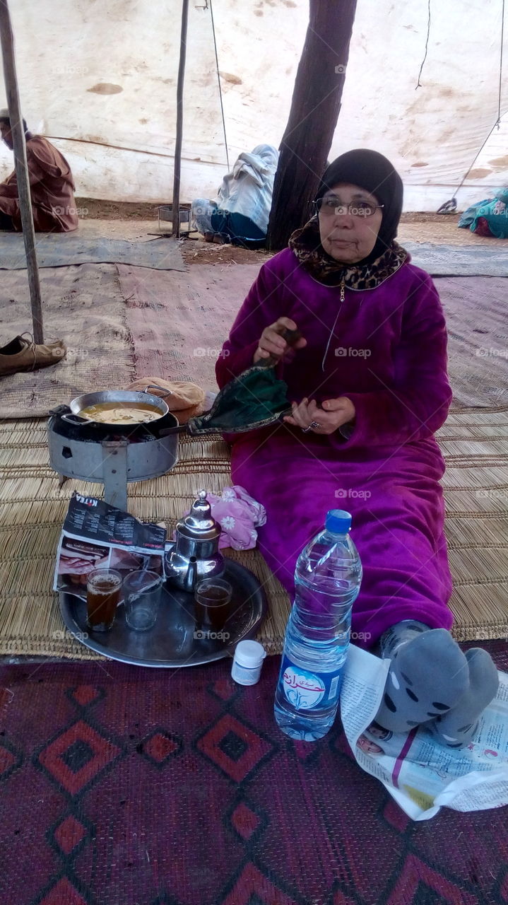 A traditional breakfast is prepared in a wild setting