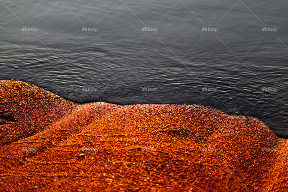 Golden sand and calm water