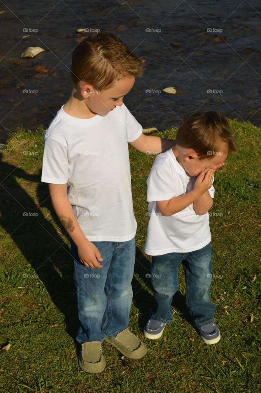 Loving on little brother during photo shoot at Covered Bridge in Elizabethton, TN