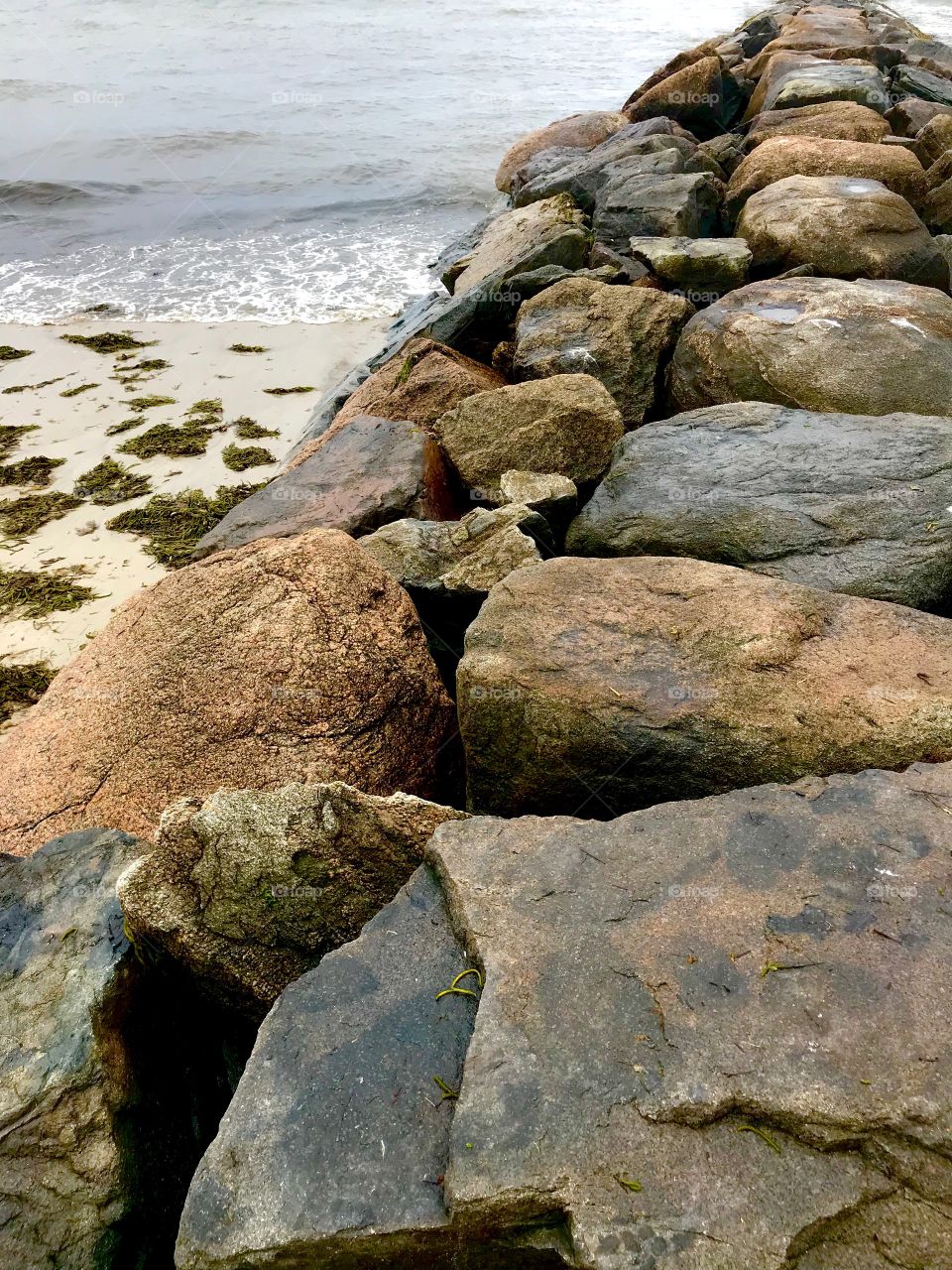 Rock jetty at Dennis Port beach in MA