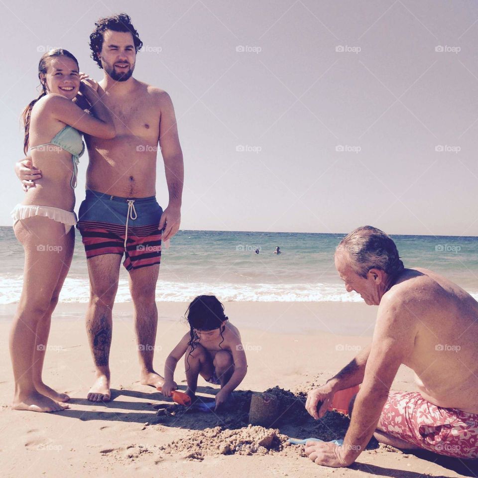 Happy family enjoying at beach
