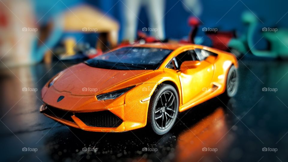 Orange Toy Lamborghini on the table