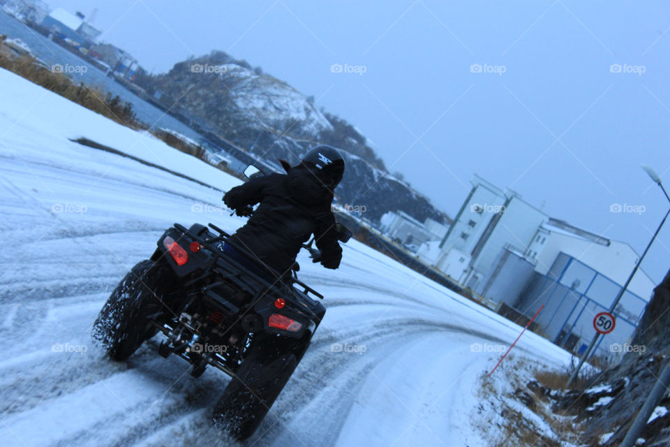 snow girl driving atv by arman