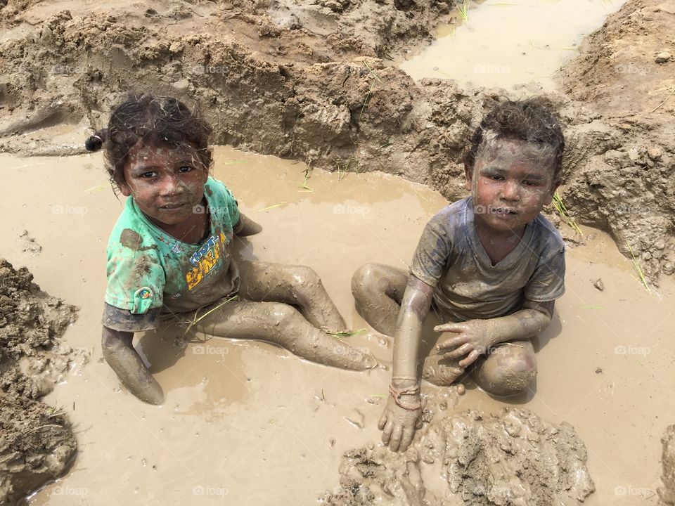 Kids playing in mud