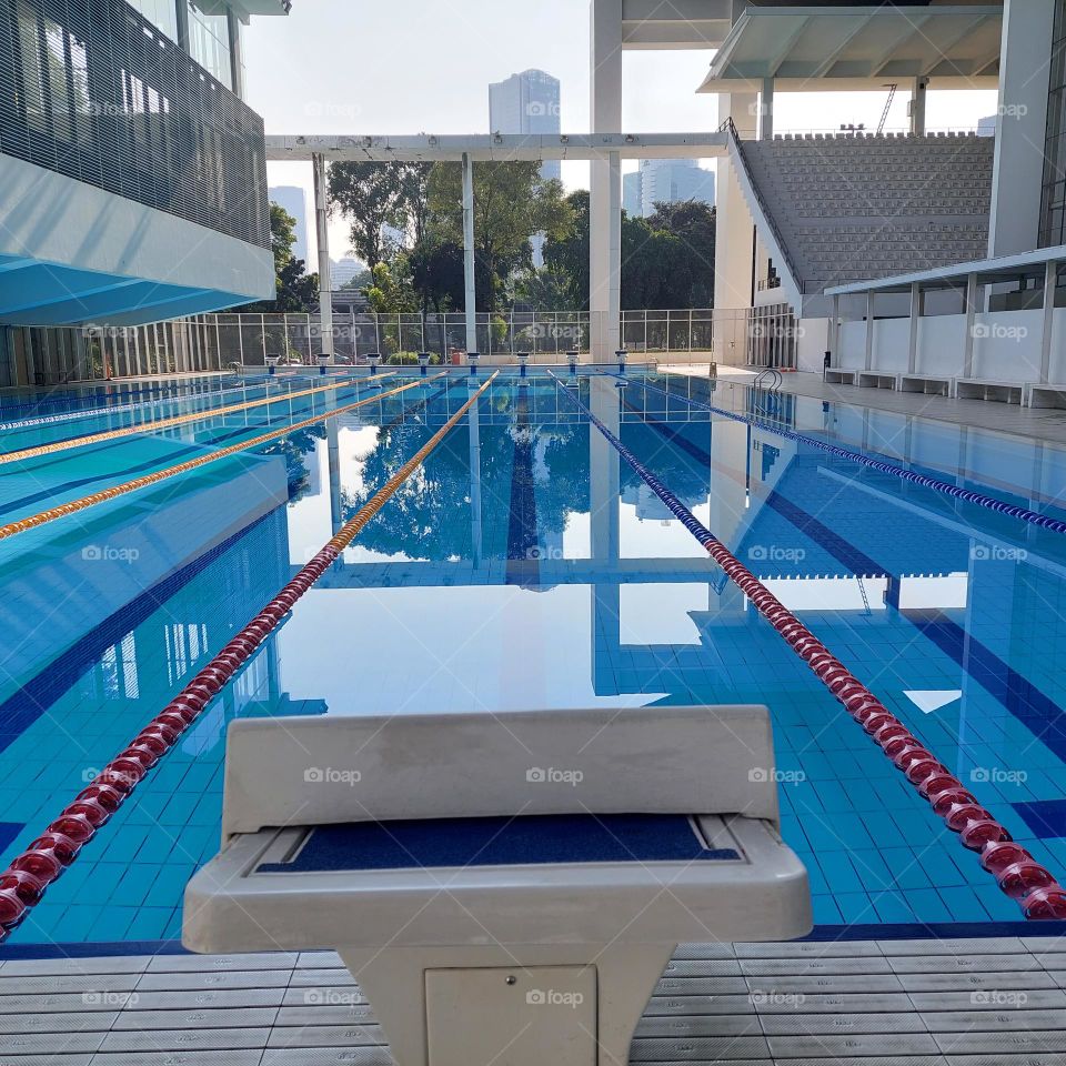 the pool area has been prepared for the swimming competition.  The swimming track has been installed in the pool and the championship is ready to start