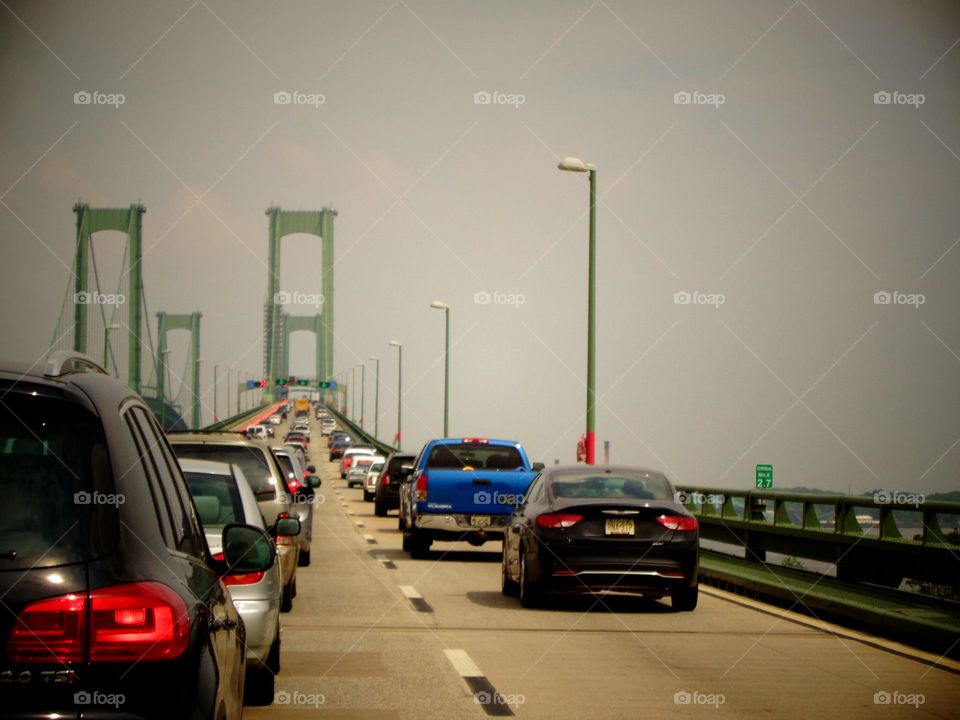 Amazing traffic on bridge during foggy roadtrip.