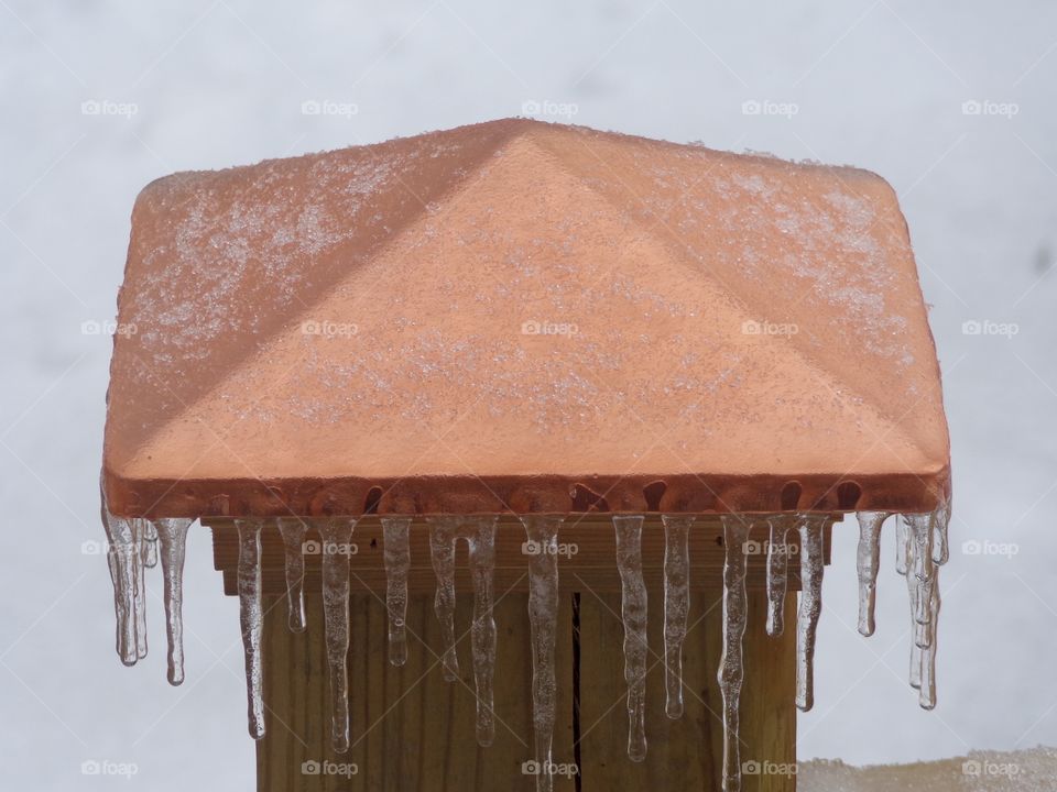 Icy Post Cap. freezing rain and sleet on a copper cap