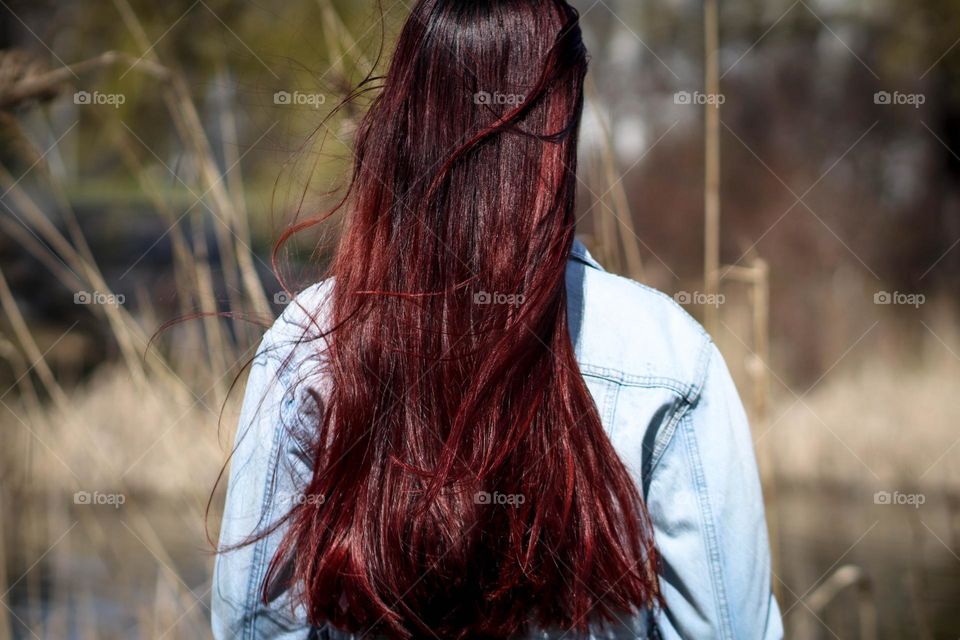 Woman with beautiful long healthy hair outdoors