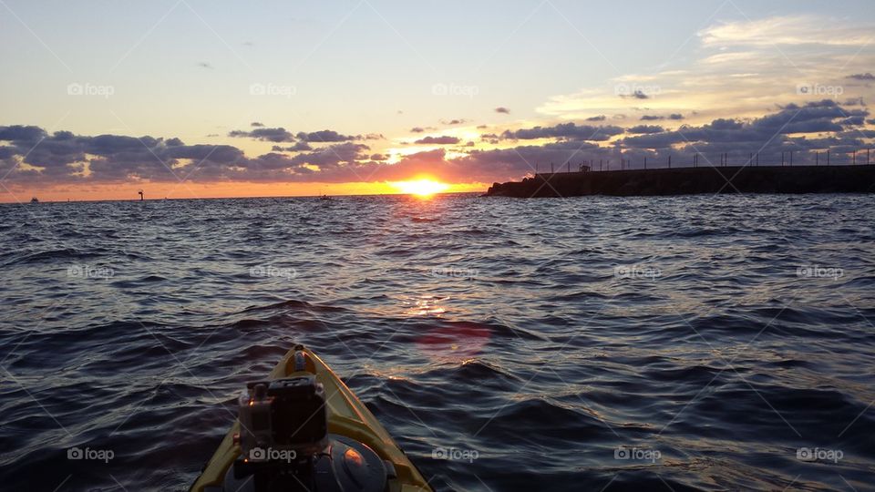 Kayak at dawn on the sea