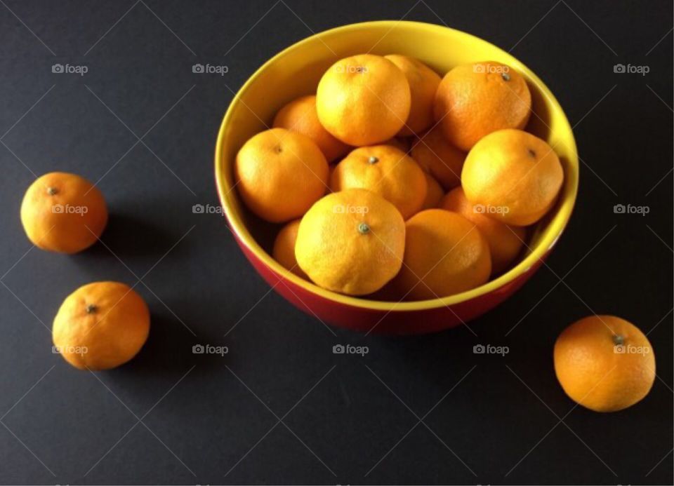 Clementines in Bowl on Black