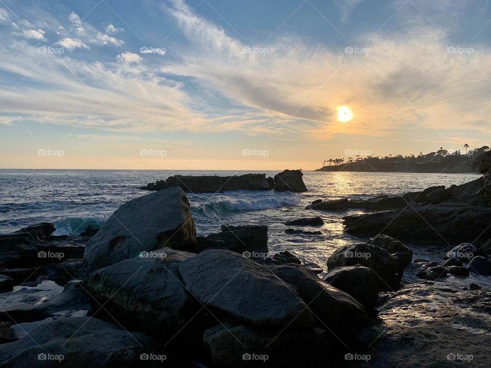 Watching the sun set by the seaside.