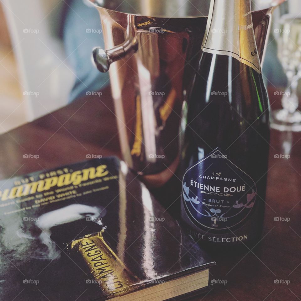 Grower champagne with rose gold ice bucket and book