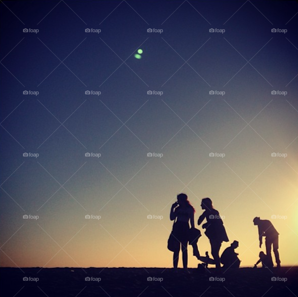 People crossing paths at the beach