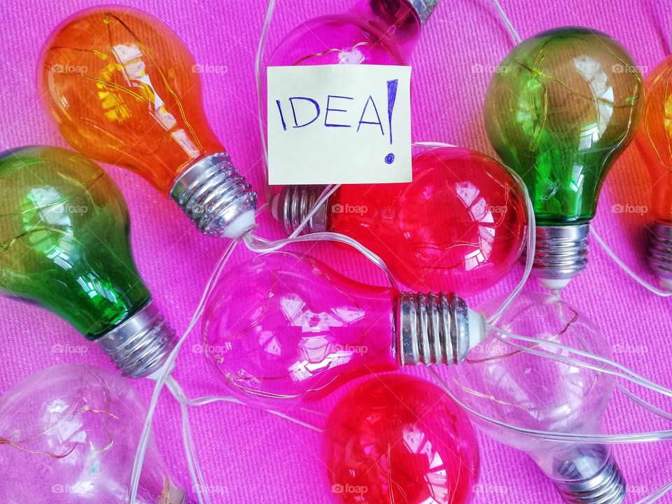 Colored bulbs and writing: "idea"