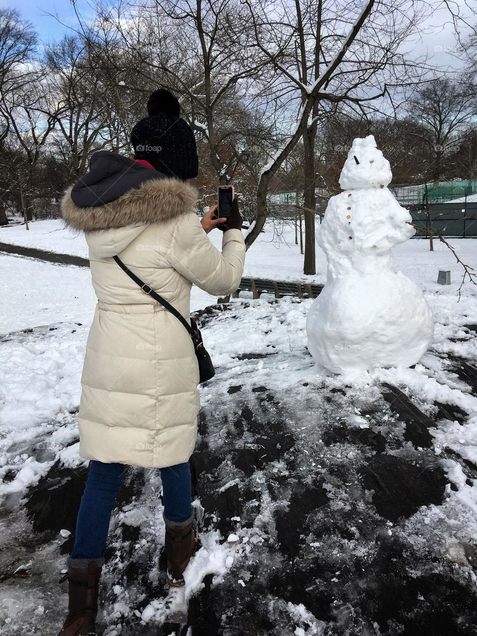 A woman and a snowman.