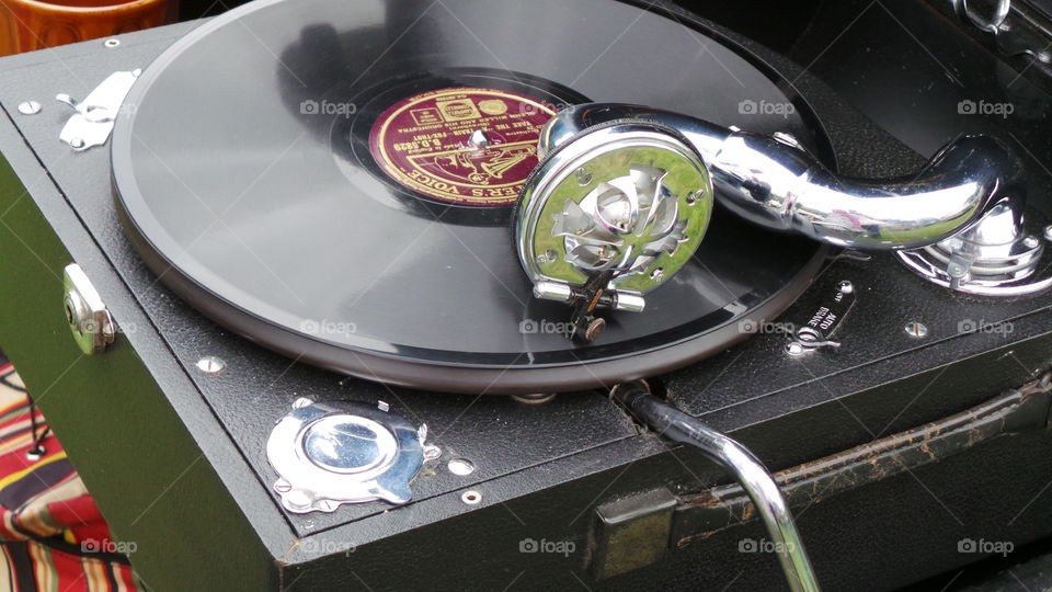 his masters voice. hmv record in a mobile record player. turn table