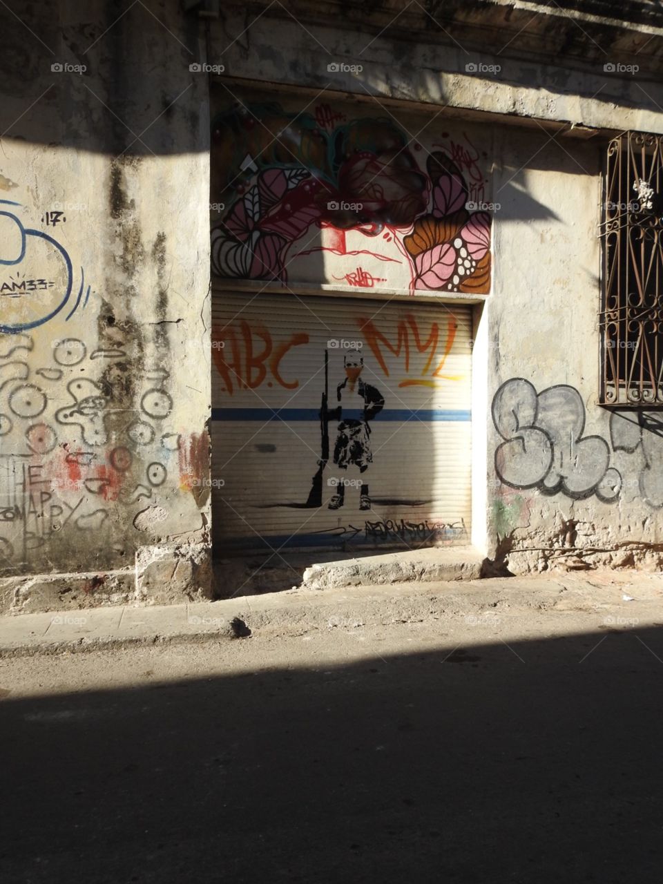 “The rebel” Interesting graffiti work located on a street in Havana Cuba 