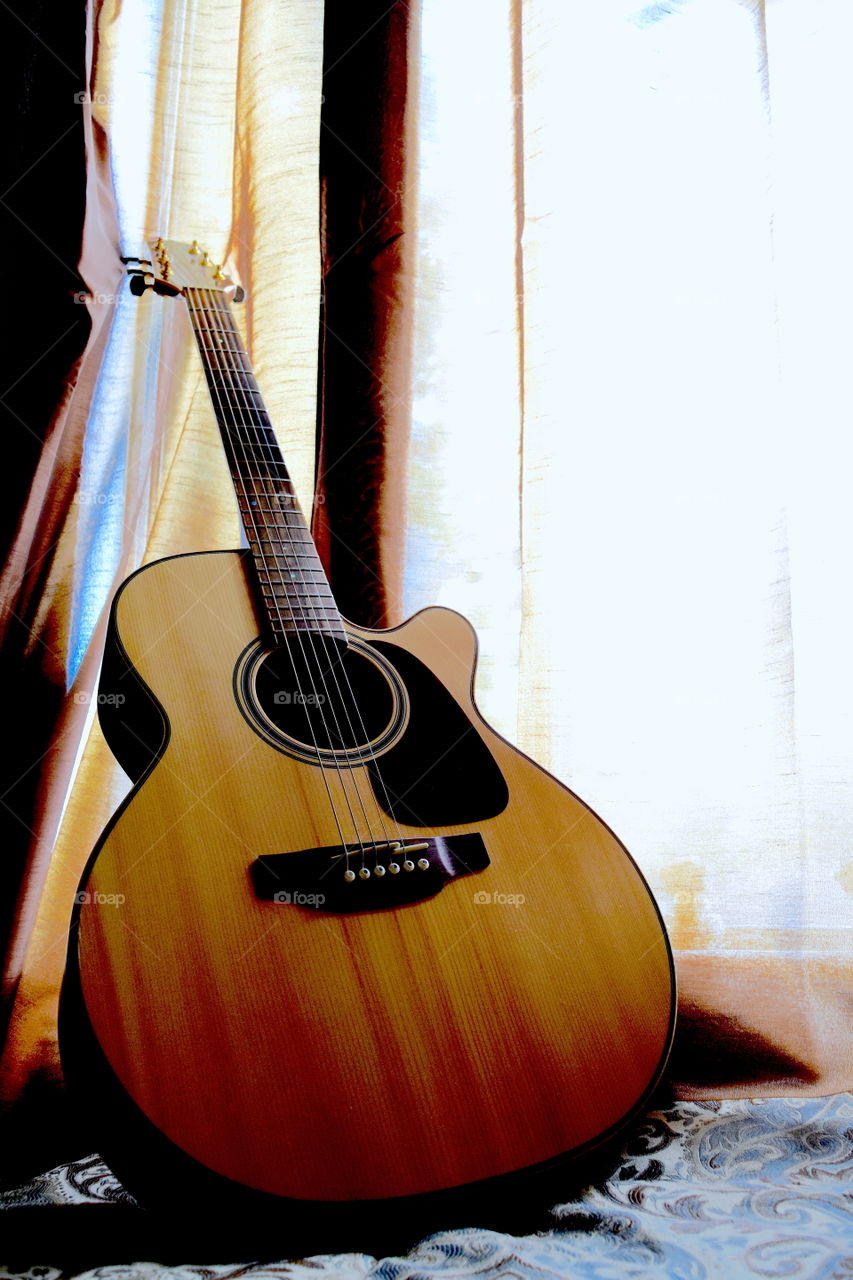 Guitar tan. A photo I decided to take of my guitar since there was some nice light coming in through my window. ! 