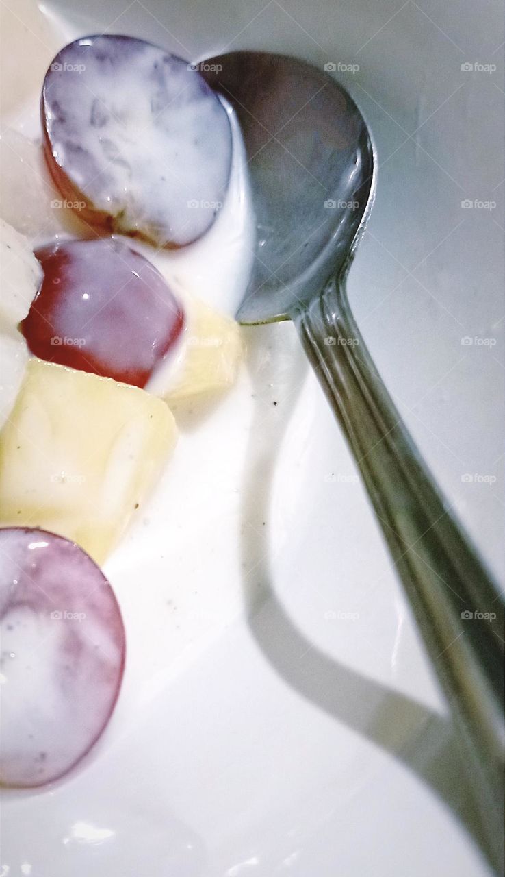 Fruit salad and spoon...