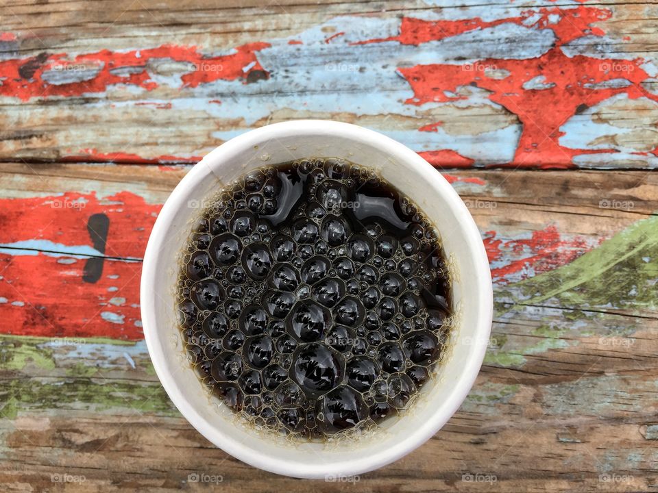 Bubbles in a cup of coffee