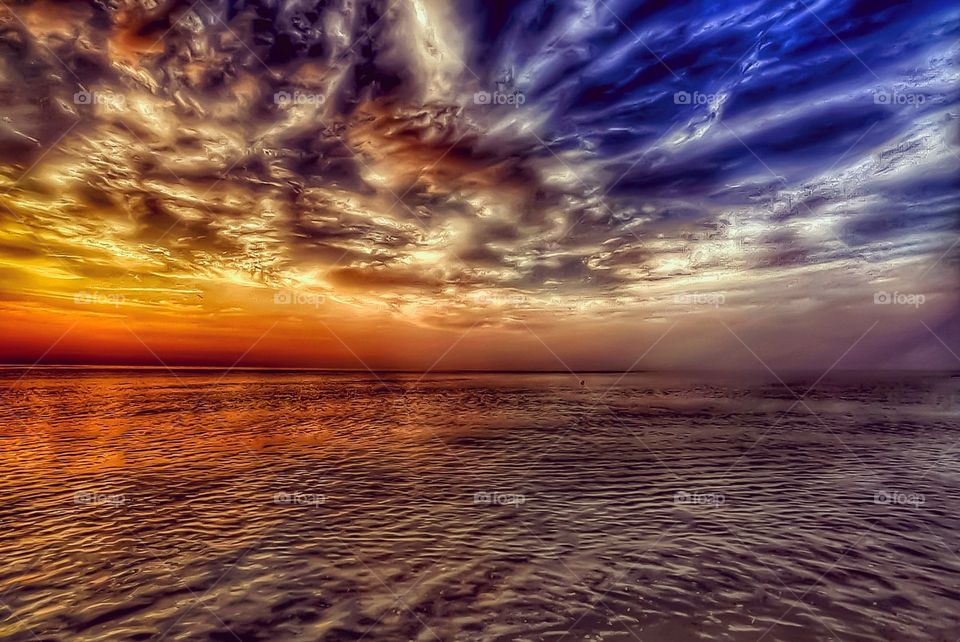 dramatic fiery and colorful sunset over lake Erie