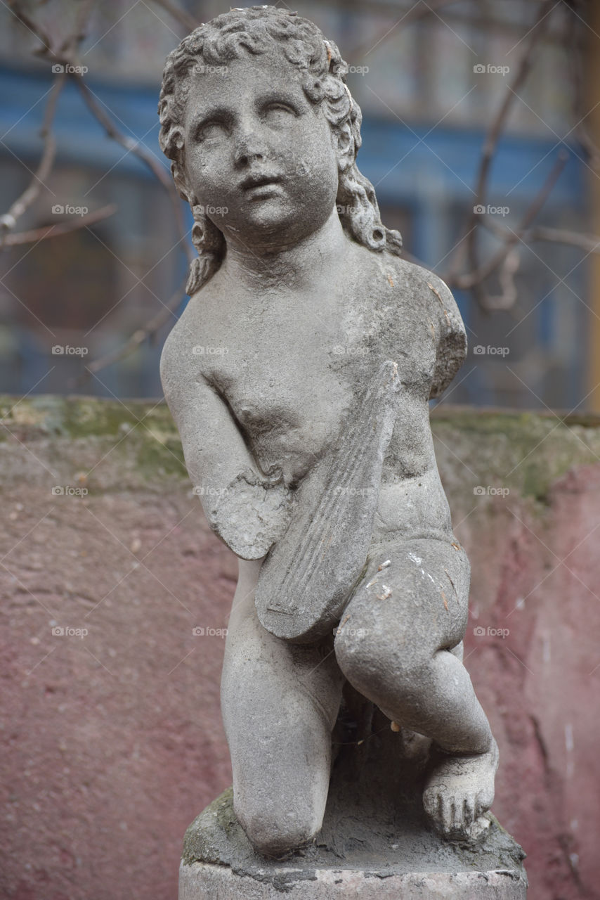 Mutilated putto in the garden of the Storck Museum, Bucharest