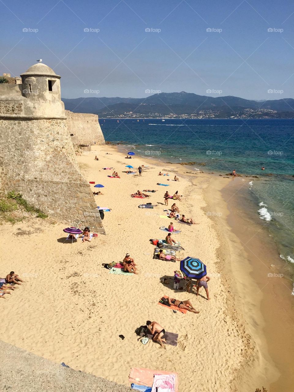 Ajaccio corse france city beach, golden city beach from above and not recognizable people sunbathing 