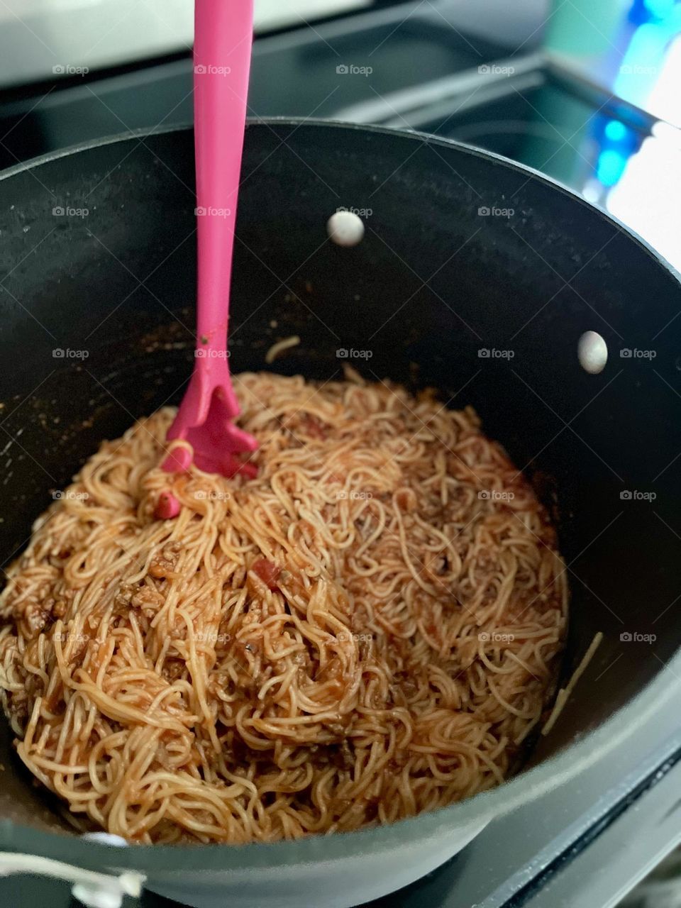 Spaghetti in large stock pot, making spaghetti dinner for the family, Mom makes dinner for the family, making dinner for picky eaters