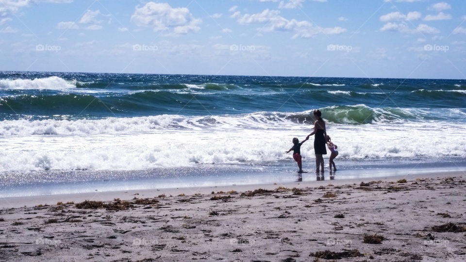 Mother with her daughters at beach