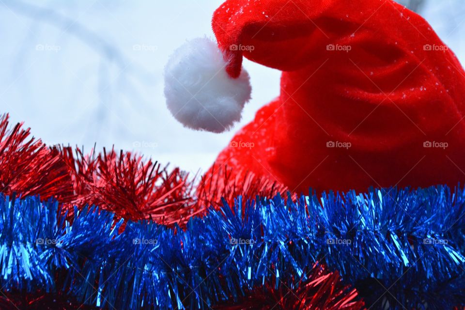 new year tinsel and red hat