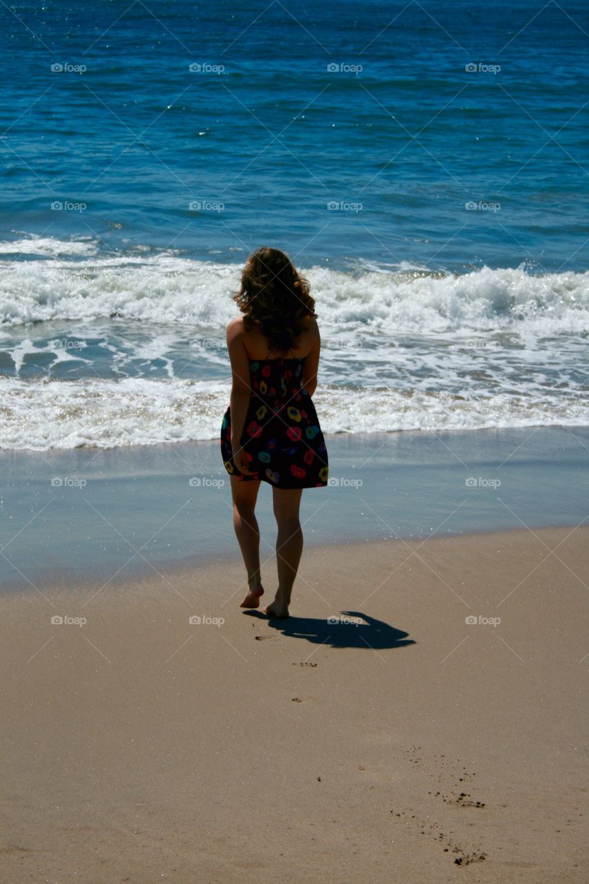Footprints . Leaving footprints in the sand to go enjoy the ocean. 
