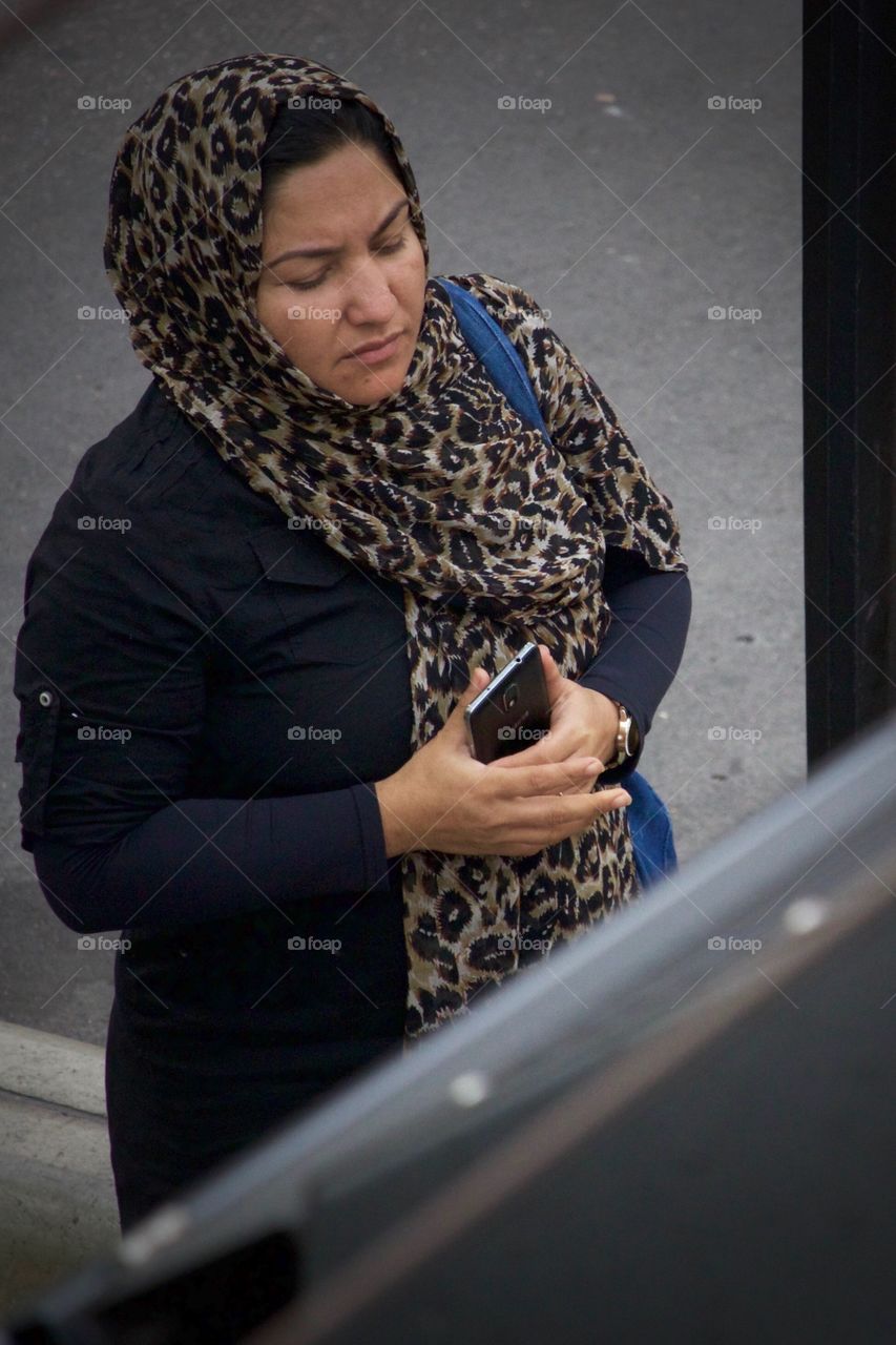 Muslim Woman Protecting Her Smartphone